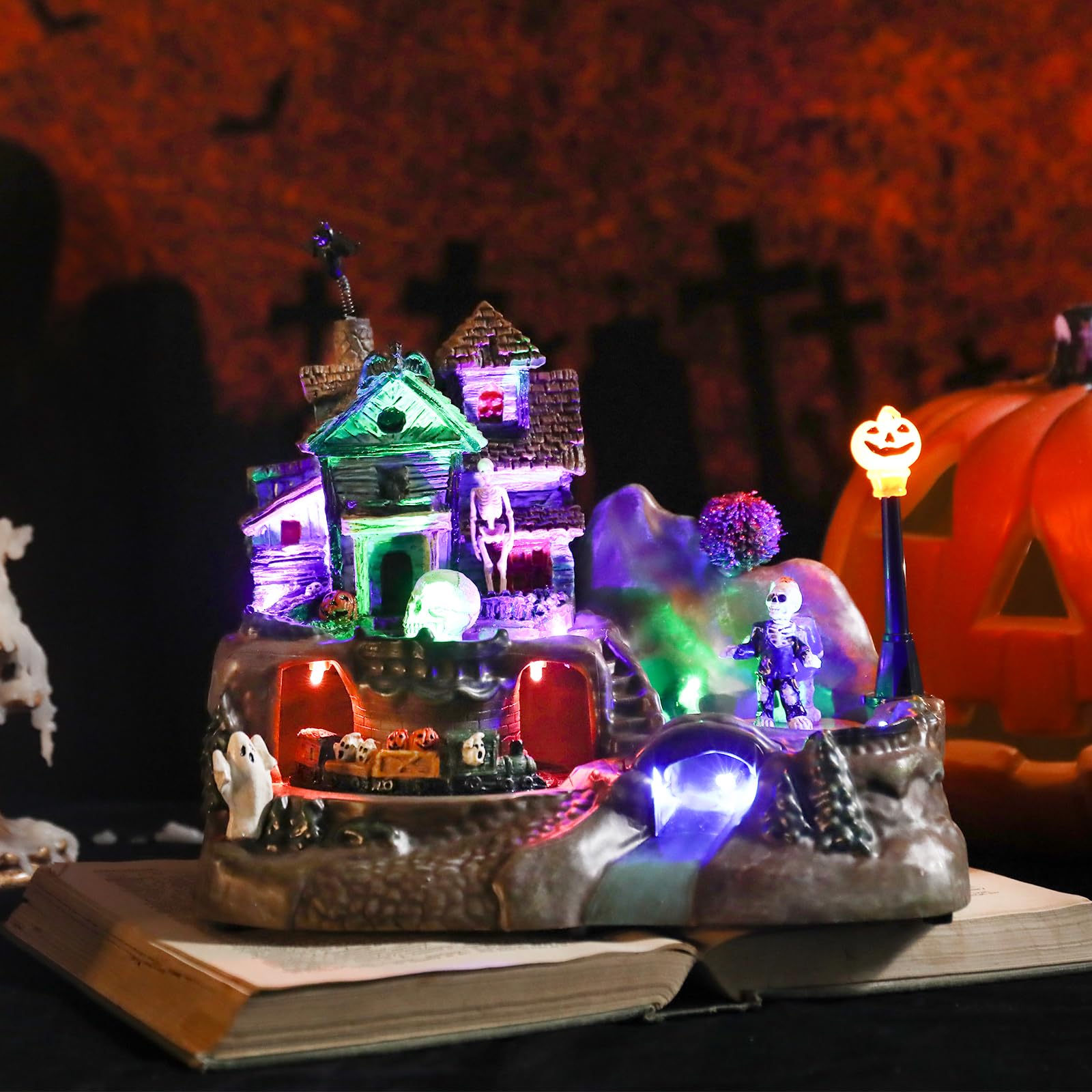 Halloween Village Houses Decorations, Lighted Haunted House with Animated Train and Scary Music, Resin Spooky Skull Village Collections for Holiday Party Table Indoor Home Decor - Halloween Happy